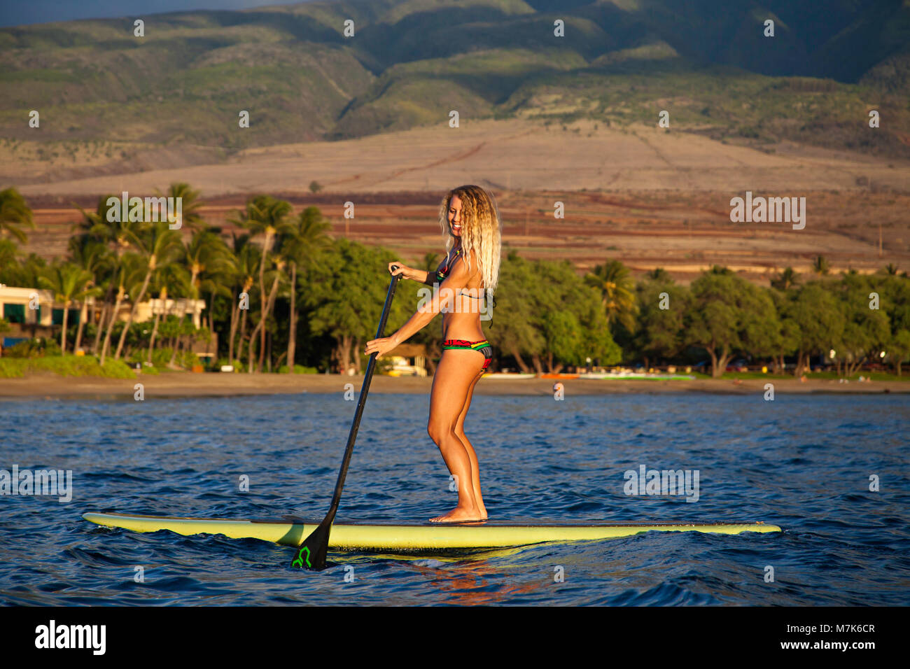 Surf instructor Tara Angioletti on a standup paddle board off Canoe