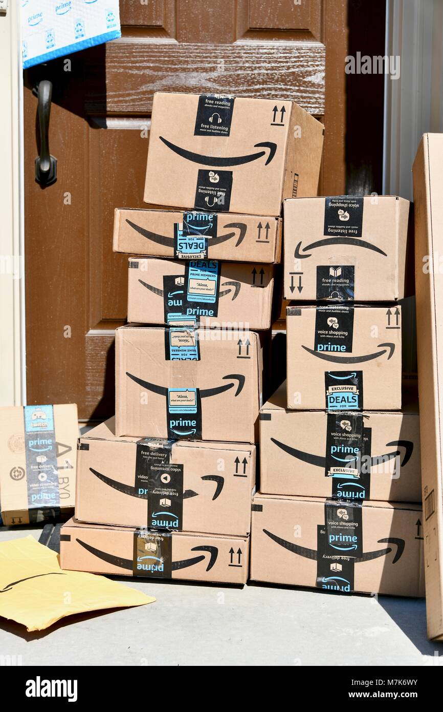 Amazon Prime boxes delivered and stacked at the front door of a residential  home, USA Stock Photo - Alamy