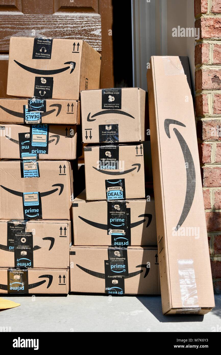 Amazon Prime boxes delivered and stacked at the front door of a