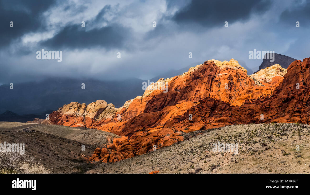 Red Rock Mountain with dark sky Background Stock Photo