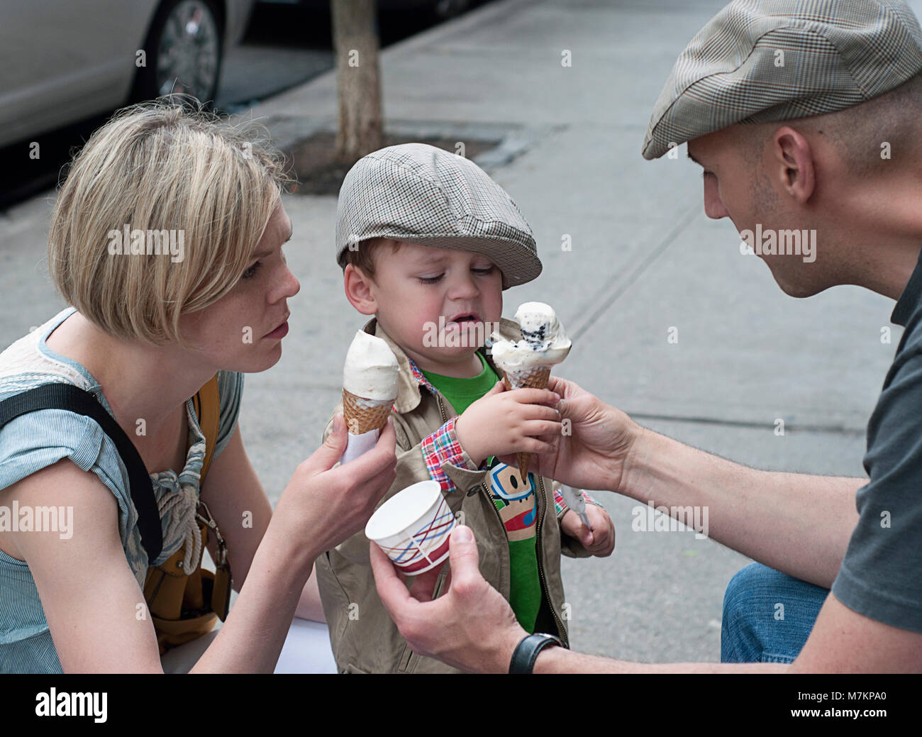 A family eating ice cream in New York city Stock Photo