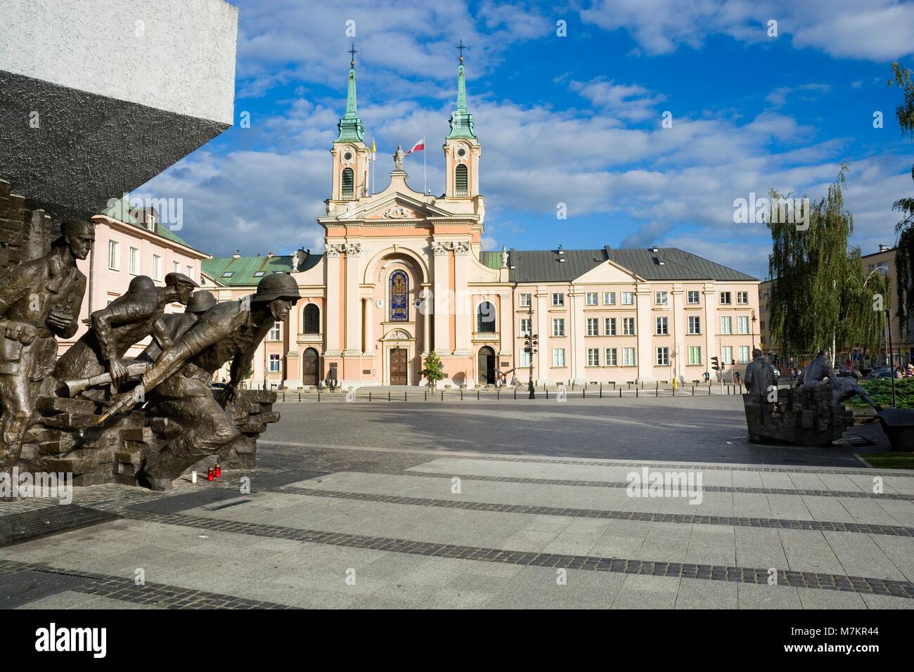 WARSAW, POLAND - AUGUST 24: Composed of two parts Warsaw Uprising Monument on Krasinski Square, the Field Cathedral of the Polish Army in the backgrou Stock Photo