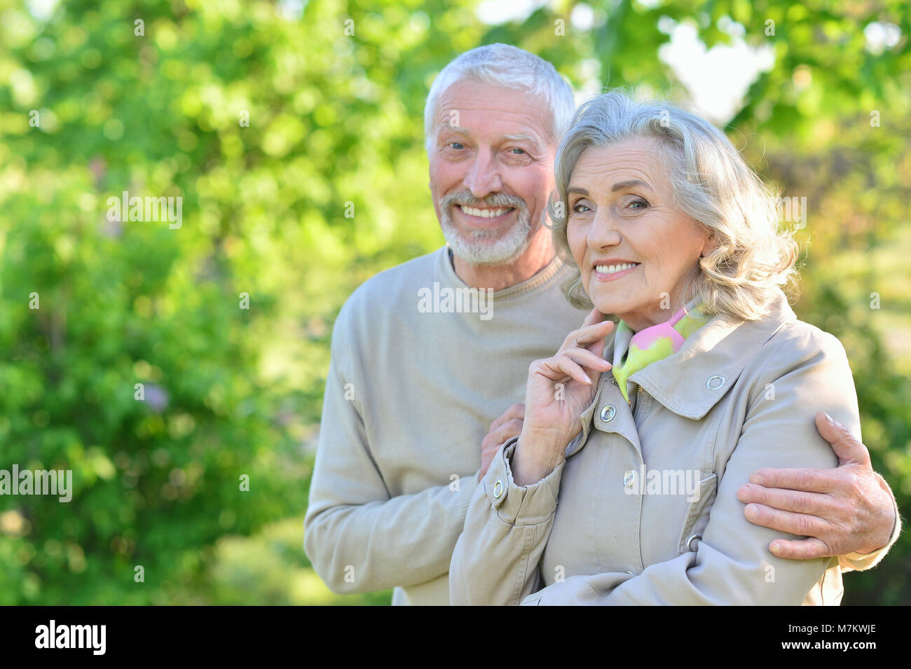 Happy couple hugging in spring park Stock Photo - Alamy