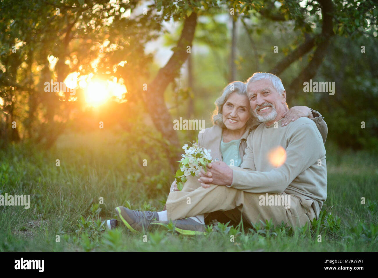 Happy couple hugging in spring park Stock Photo - Alamy