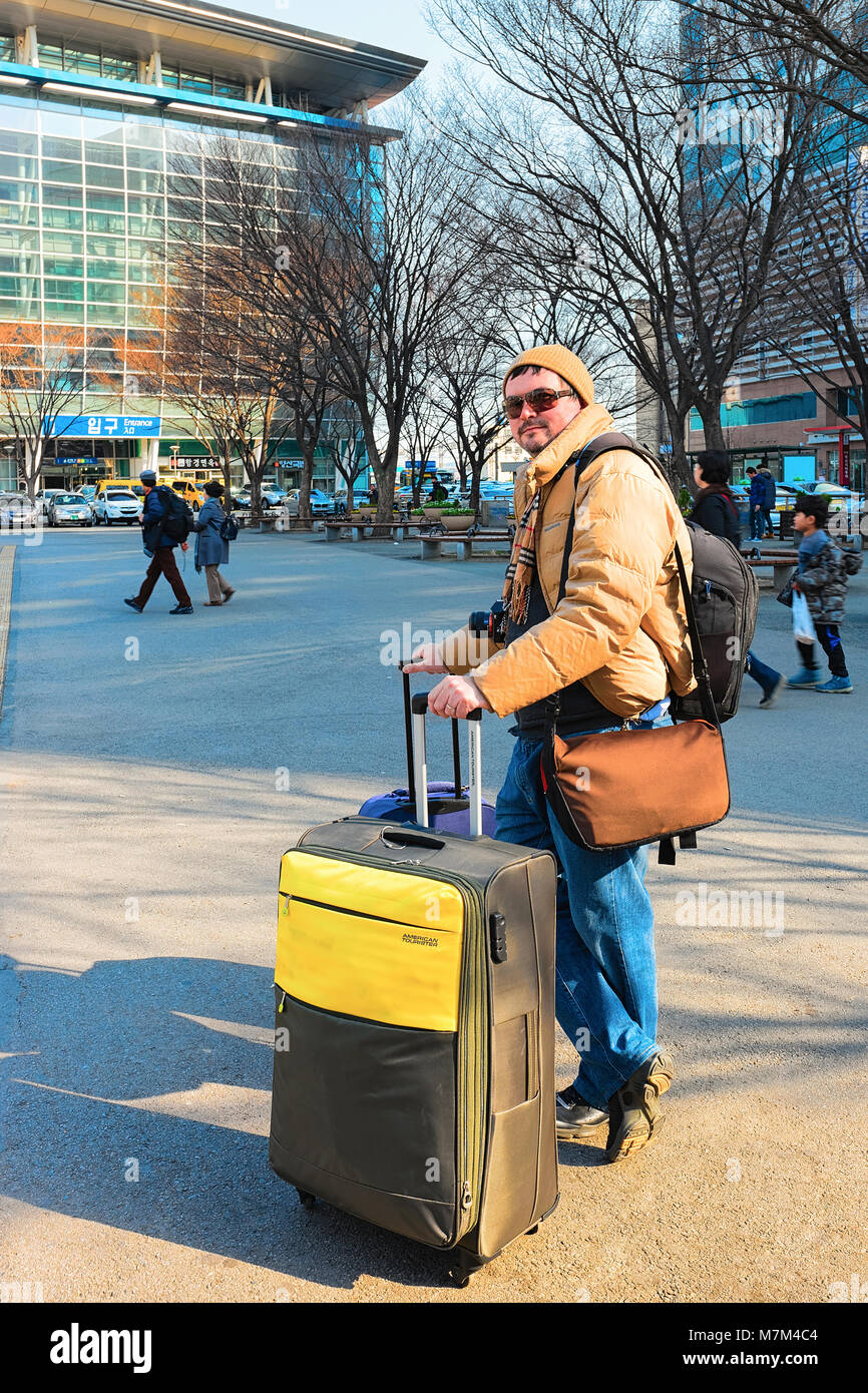 Busan, South Korea - March 12, 2016: Passenger with lugagge bags at the Railway station in Busan, South Korea Stock Photo