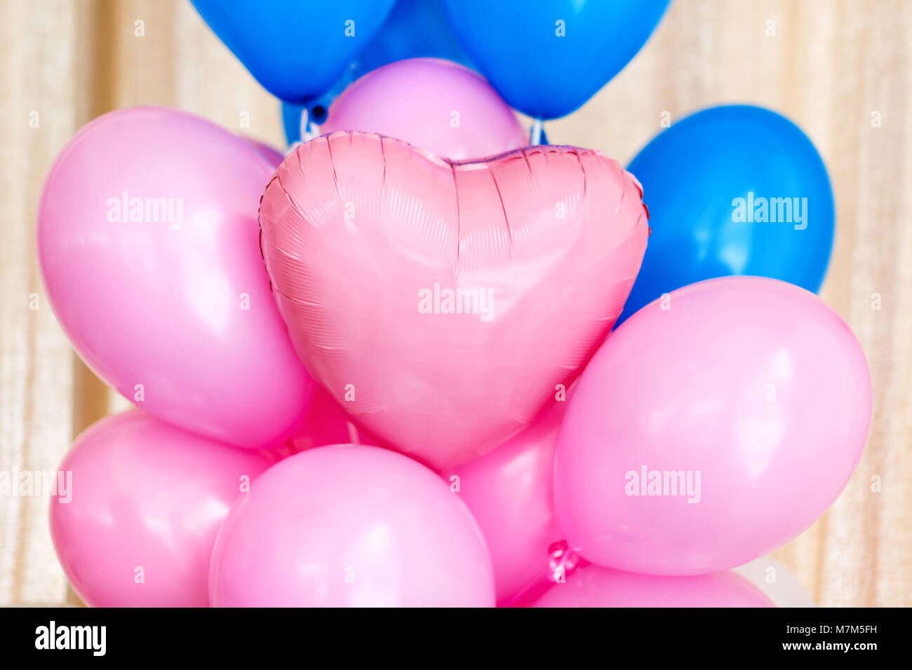 Pink and blue inflatable balloons. Decorations for birthday party. Stock Photo