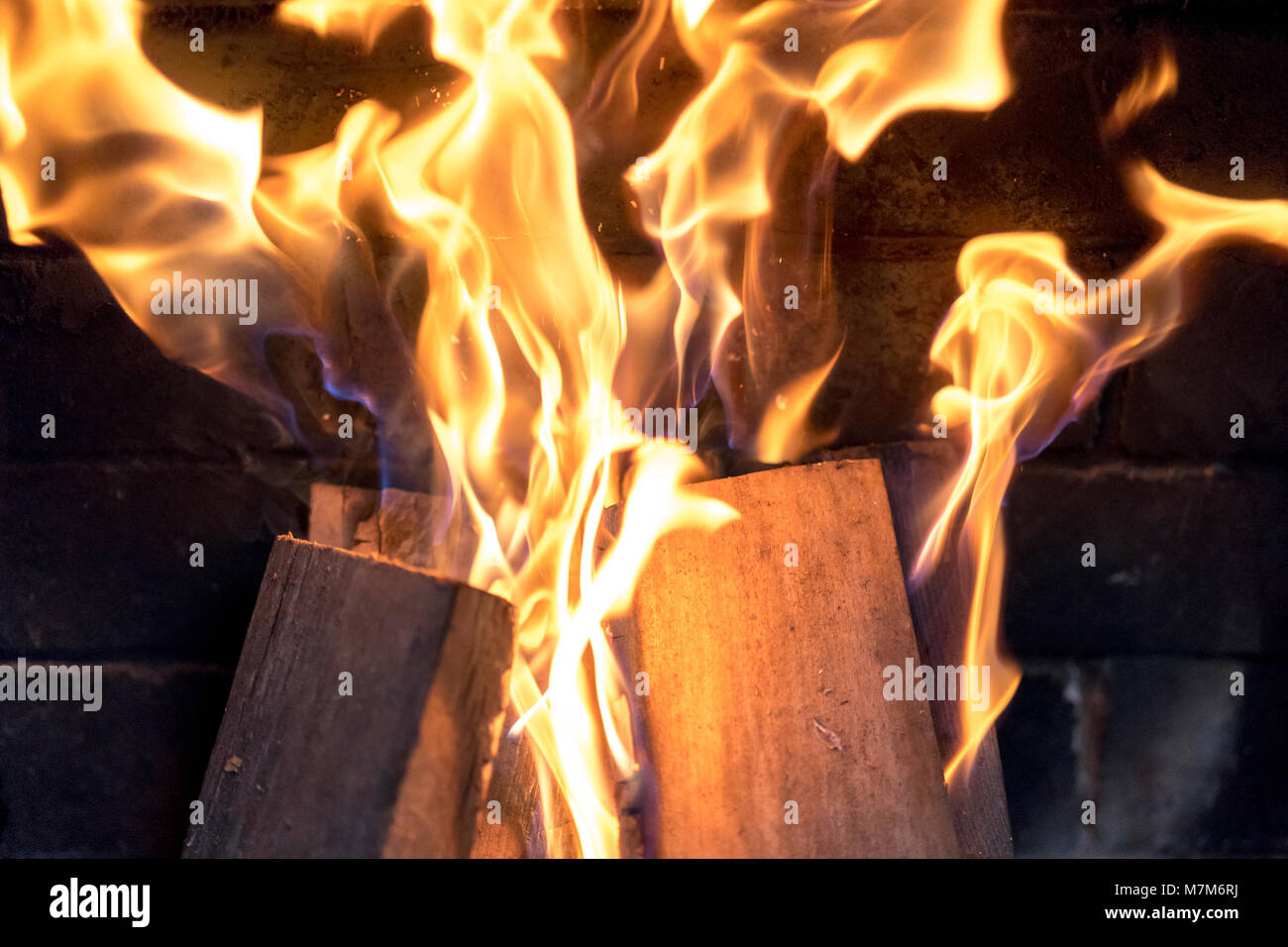 red yellow fire in the fireplace close-up. flames. Fire background ...