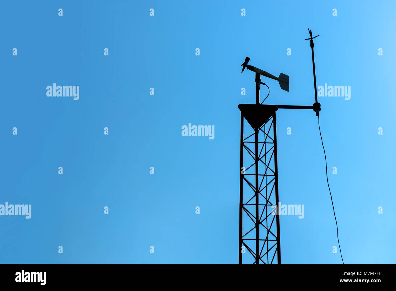 Smart agriculture and smart farm technology concept. Revolving vane anemometer, a meteorological instrument used to measure the wind speed and solar c Stock Photo
