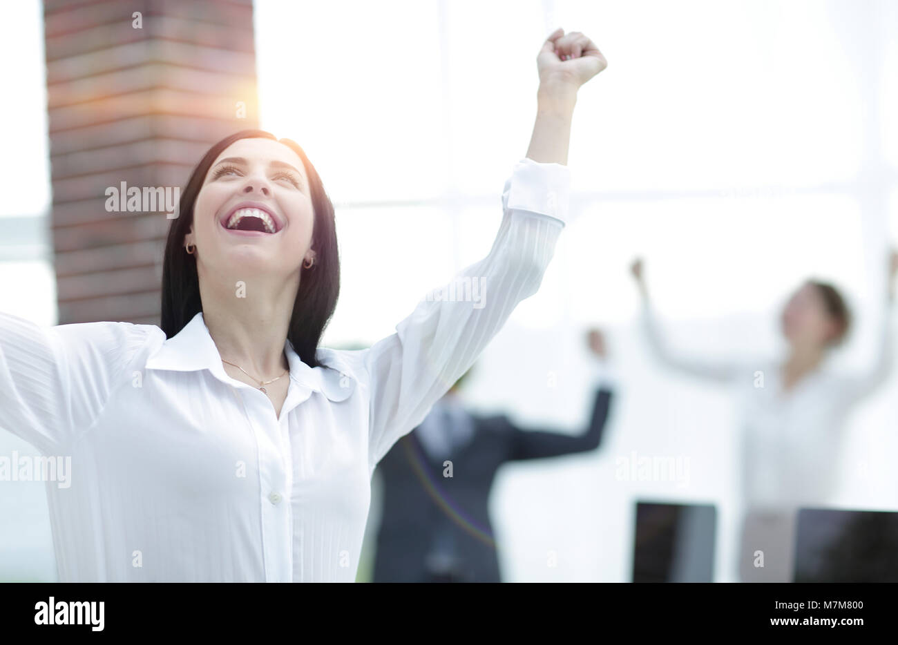 happy young business woman on a blurred office background Stock Photo ...