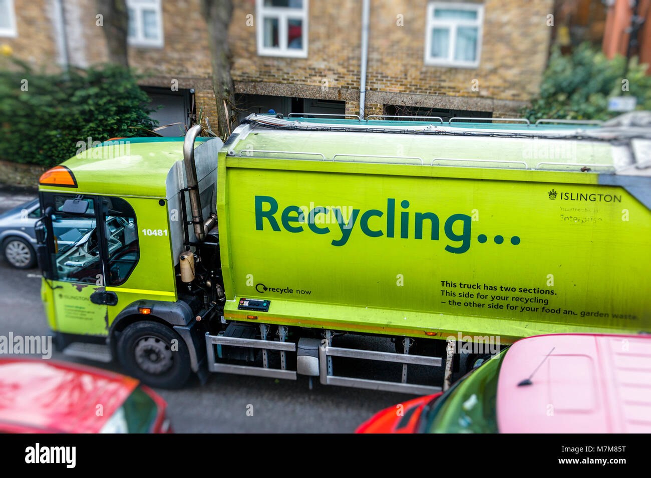 Recycling lorry making its weekly collection in a residential street in Islington, London, UK Stock Photo