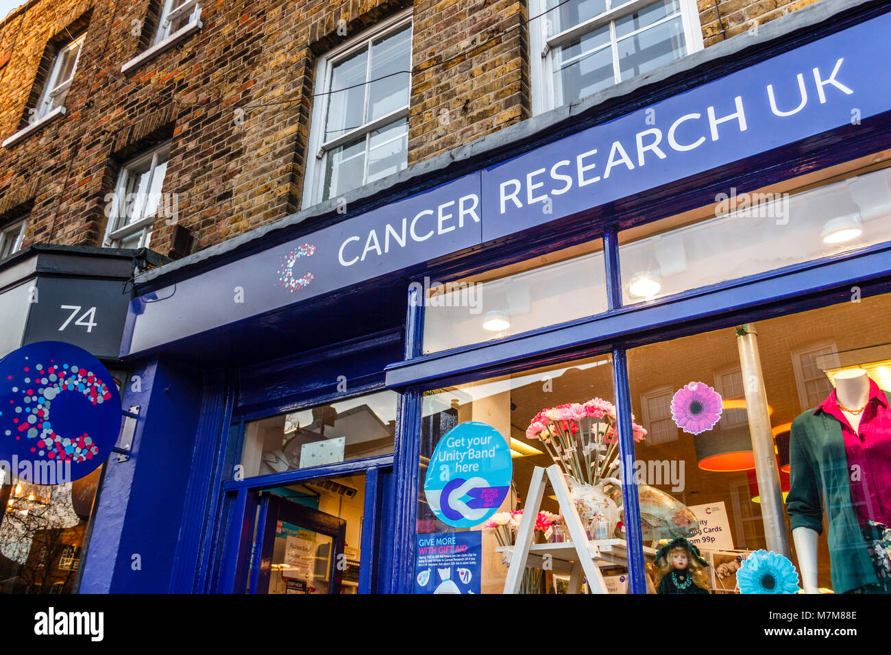 Facade of a Cancer Research charity shop in Highgate Village, London, UK Stock Photo