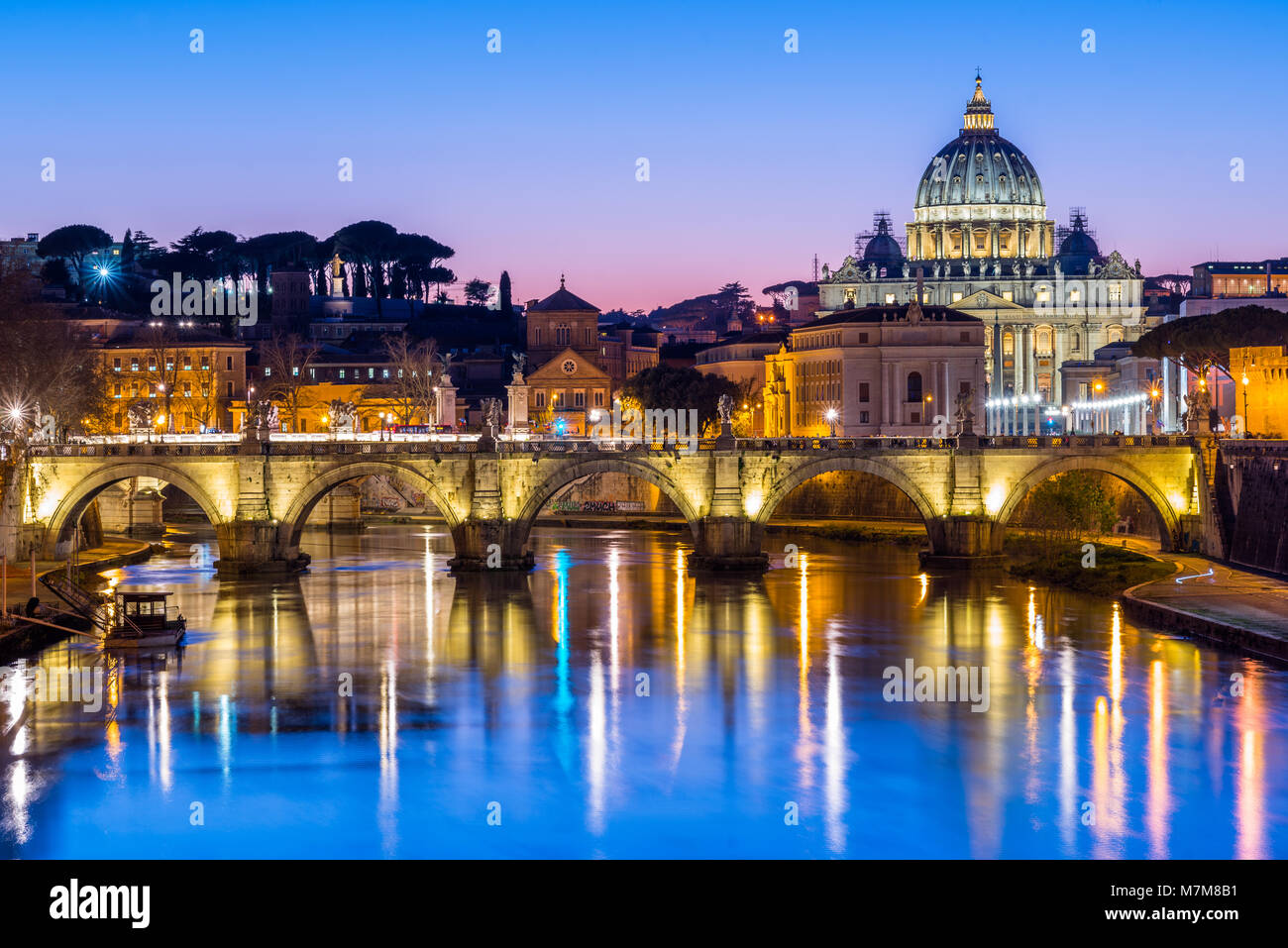 St Peter's Cathedral and Vatican city seen at dusk, over the river Tiber. Rome, Lazio, Italy. Stock Photo