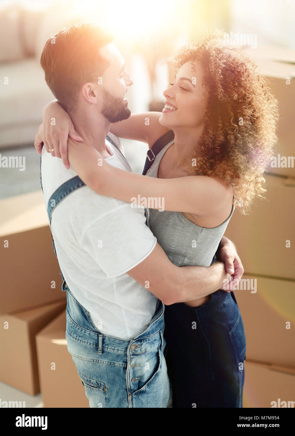 Portrait of a young couple moving into a new home Stock Photo - Alamy
