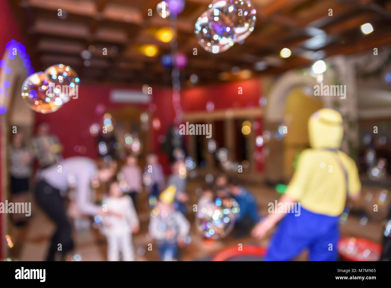 Soap bubble show, birthday party, entertainment for children, blurry background Stock Photo
