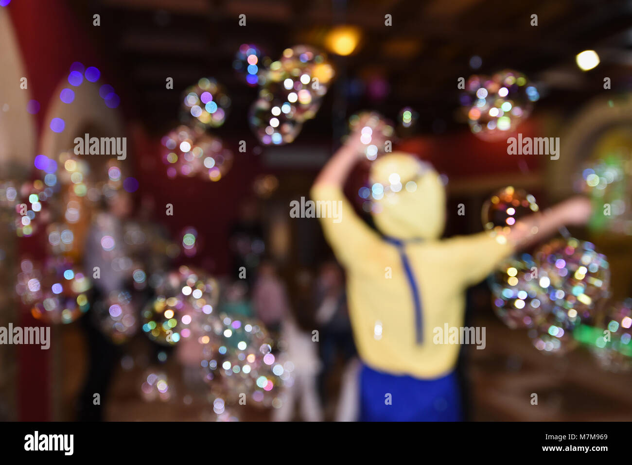 Soap bubble show, birthday party, entertainment for children, blurry background Stock Photo