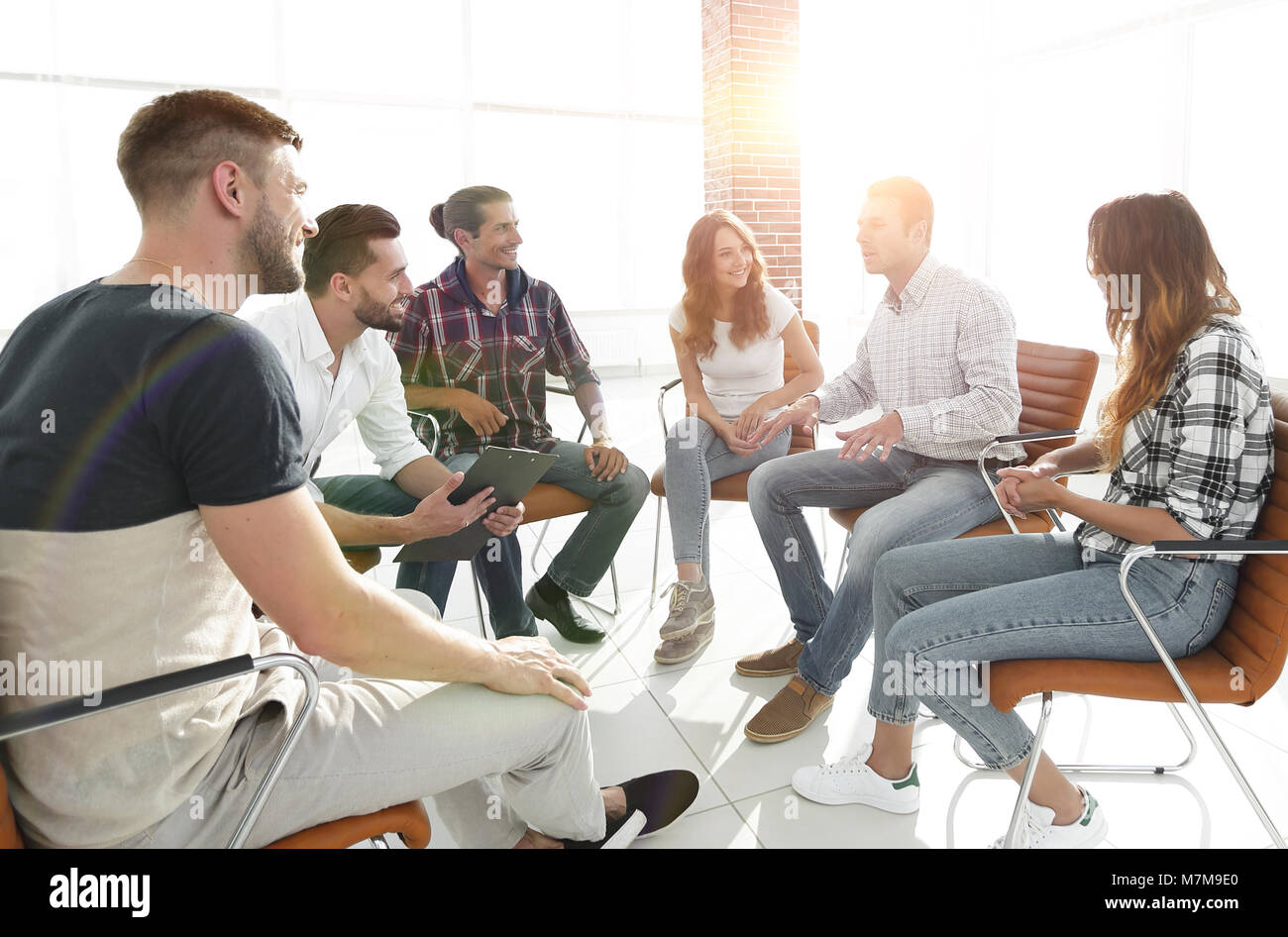creative team sitting in the lobby of the office Stock Photo - Alamy
