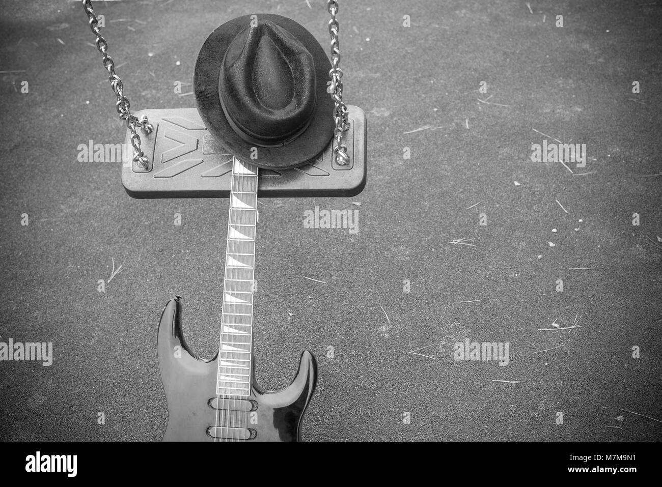 Electric guitar on a swing, a music genre concept Stock Photo Alamy
