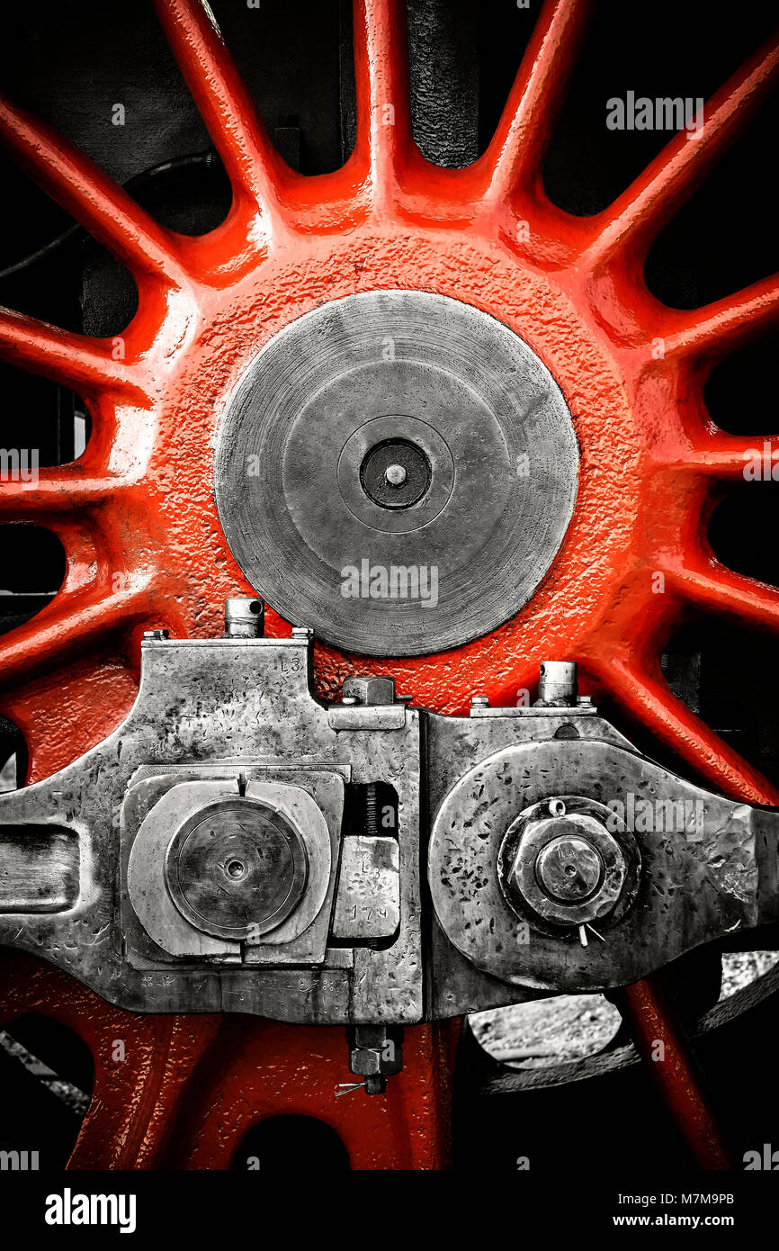 Detail of locomotive red wheel. Black&white image with selective coloring. Stock Photo