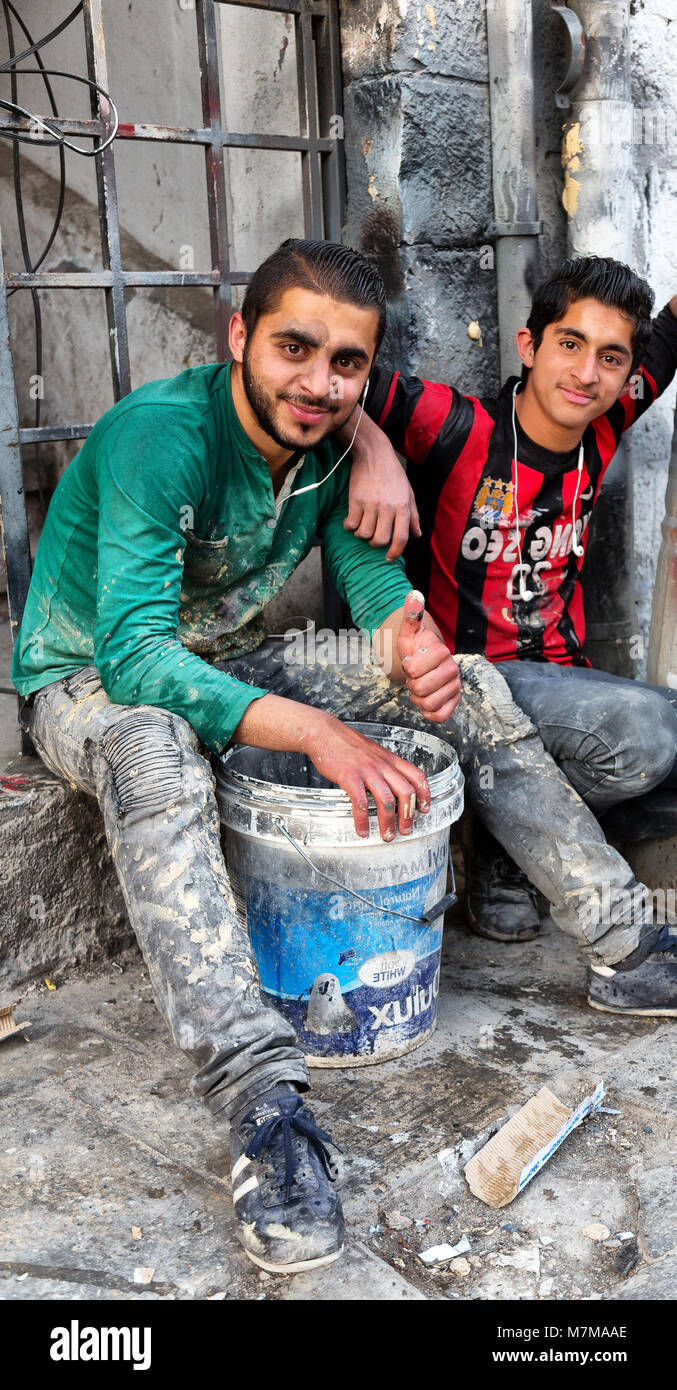 AMMAN,jORDAN-CIRCA  APRIL 2018--unidentified  young  bricklayers in the workplace Stock Photo