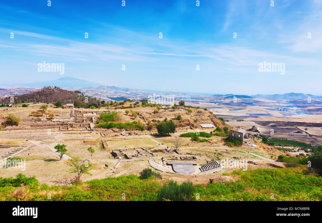 Greek theater and other ruins of old town in Morgantina archaeological site, Sicily, Italy Stock Photo