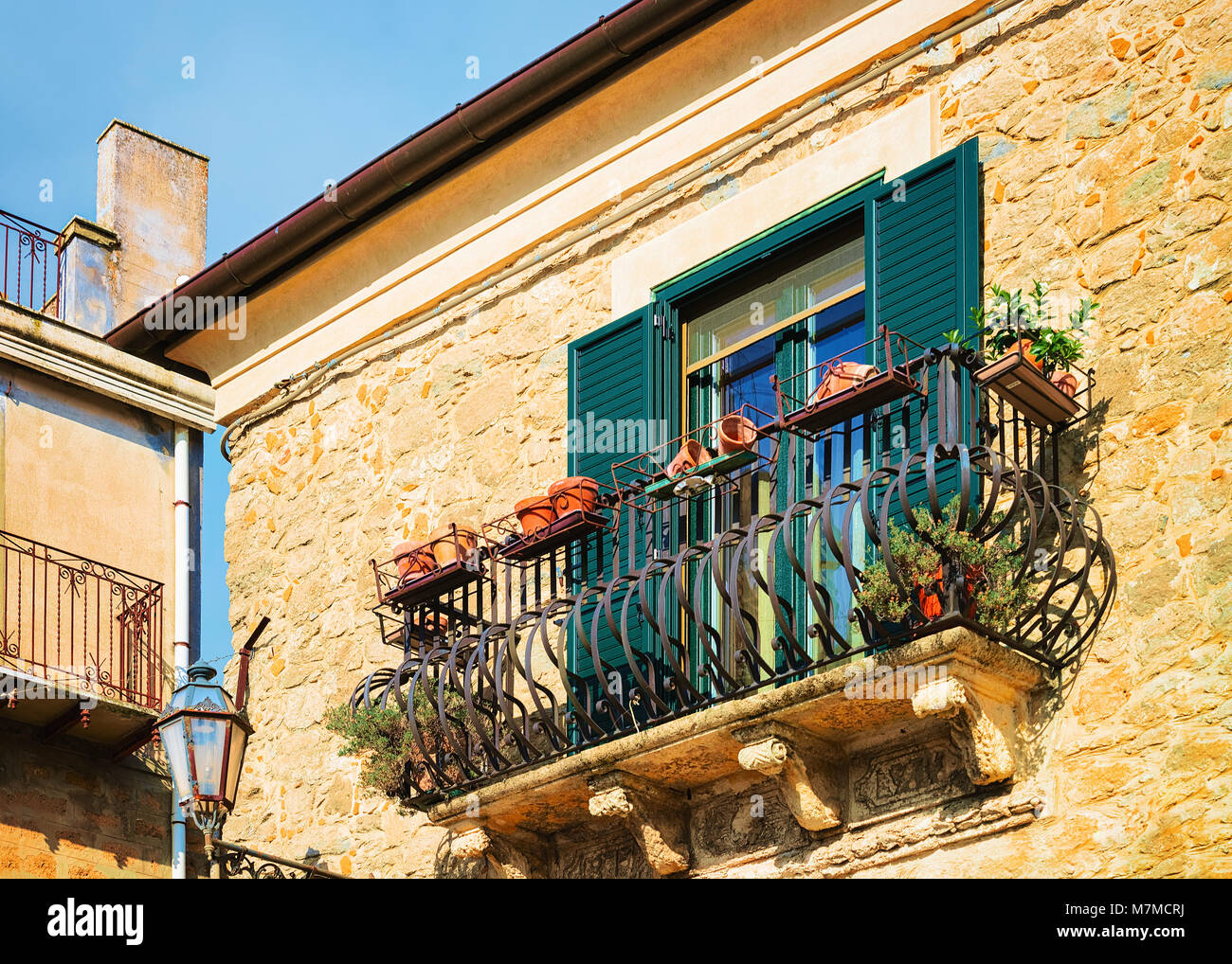 Balcony of the old house in Aidone, Enna province, Sicily in Italy Stock Photo