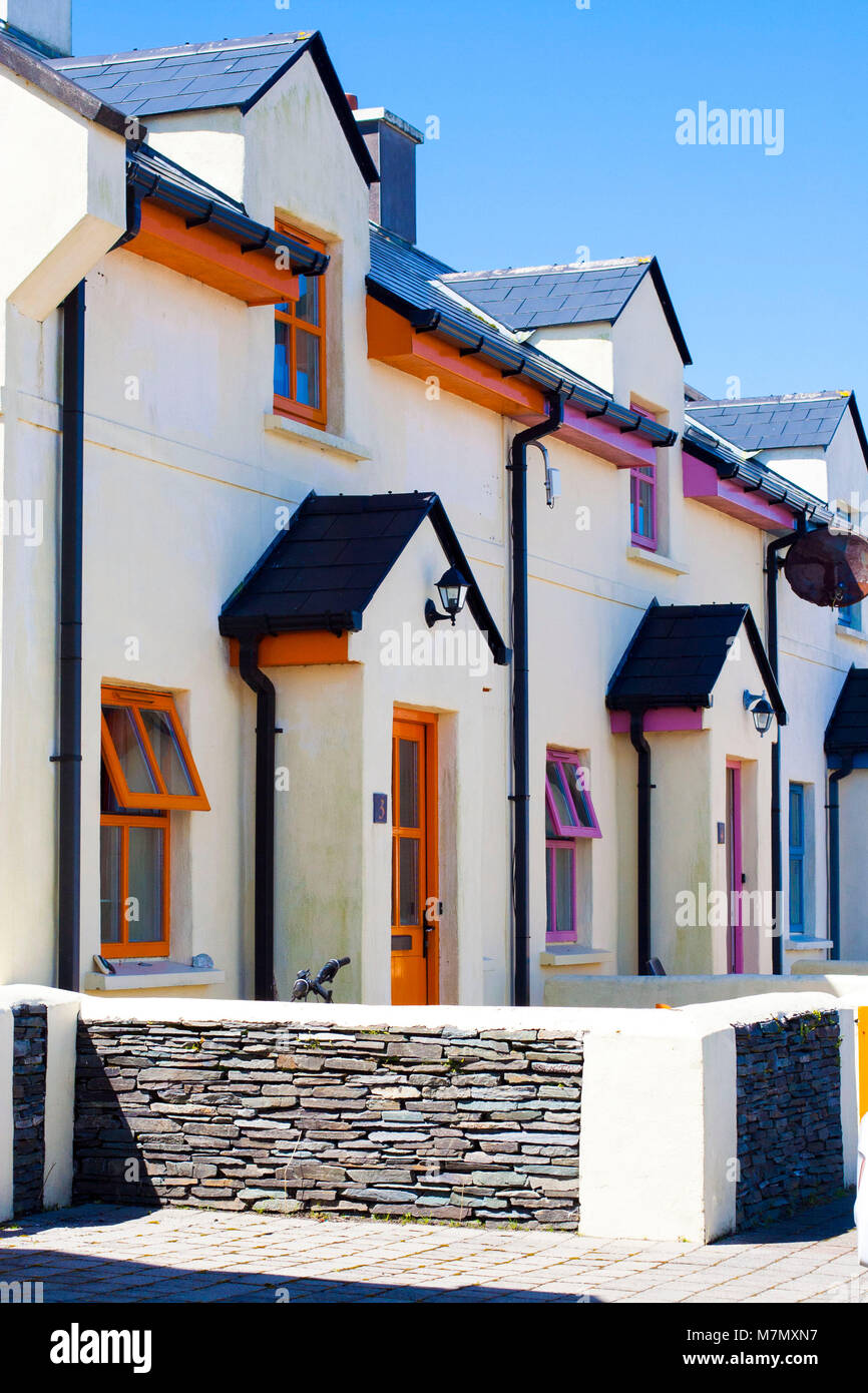 A row of colourful / colorful multi-coloured houses , white washed cottages Kerry Ireland Stock Photo
