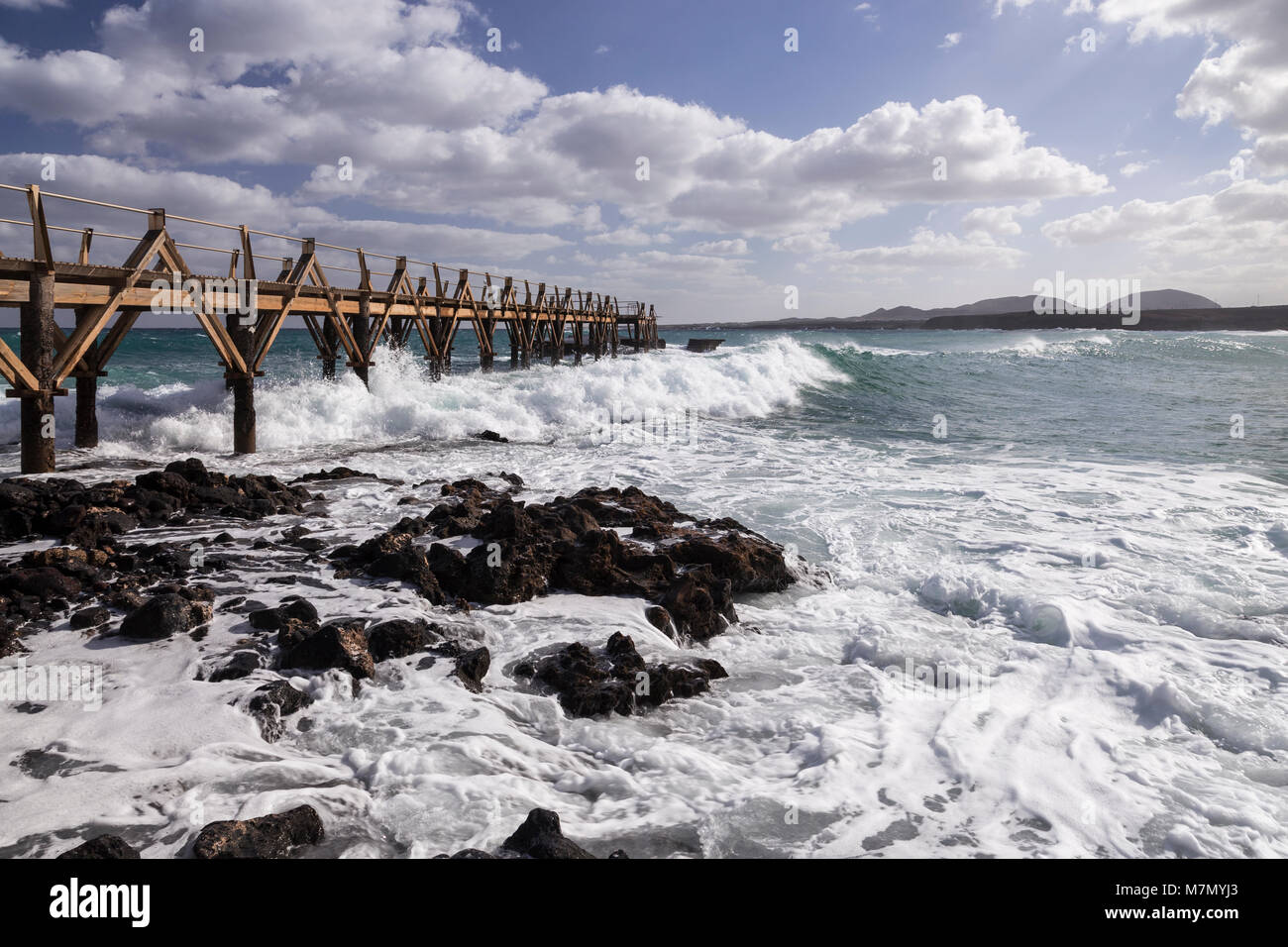 Jetty on the shoreline at Arrieta, Lanzarote, Canary Islands Stock Photo