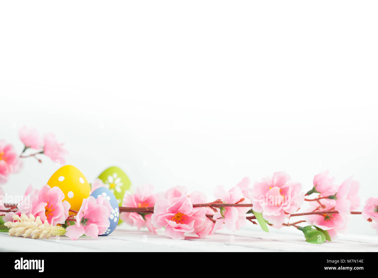 Easter eggs on white wooden table background Stock Photo