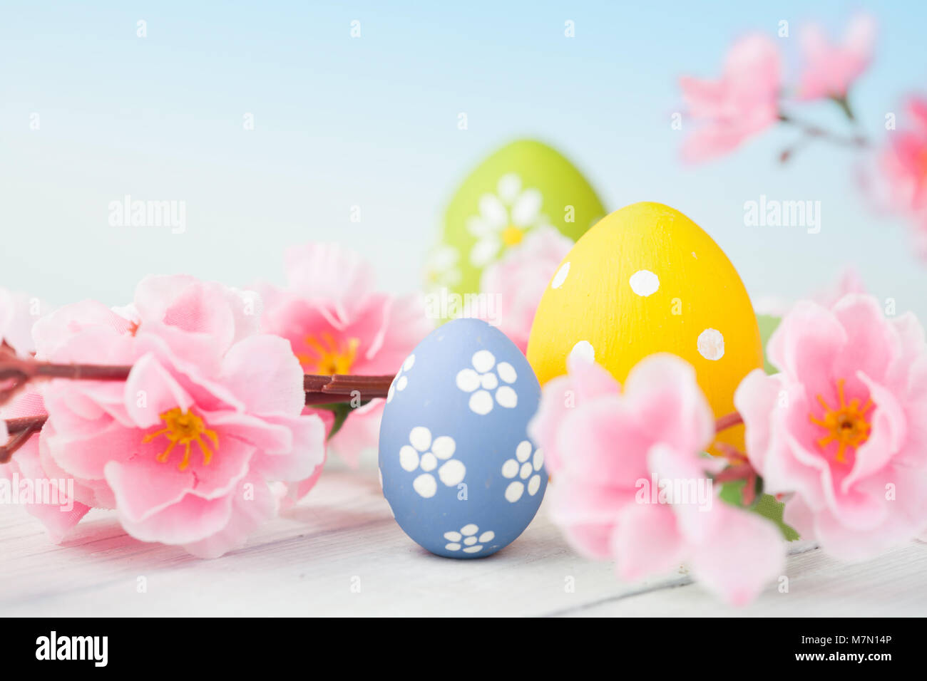 colorful easter eggs and branch with flowers Stock Photo - Alamy