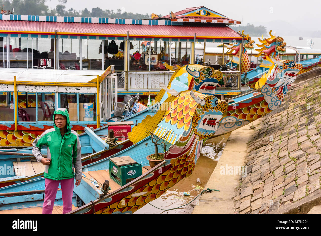 Dragon boats which can be hired by tourists on the bank of the Perfume River, Hue, Vietnam Stock Photo