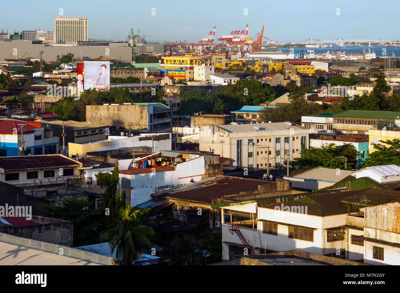Aerial view of Cebu City looking east, with port area and Mactan Island beyond, Philippines Stock Photo
