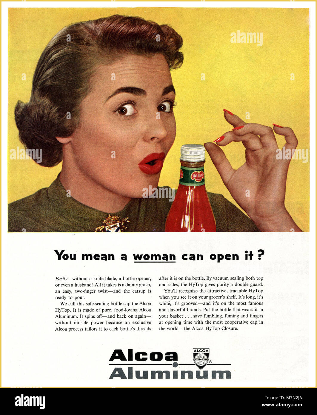 Sexist Poster Press Advertisement Advertising ‘You mean a woman can open it ? 1950s USA America Non PC Stereotype Stock Photo