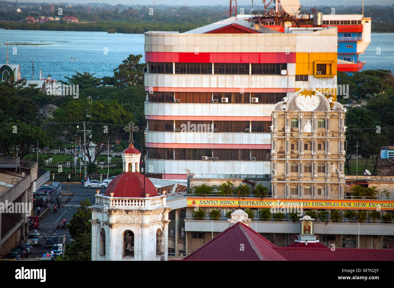 Aerial view of Cebu City city with Osmena Boulevard and Mactan Island looking east, Philippines Stock Photo