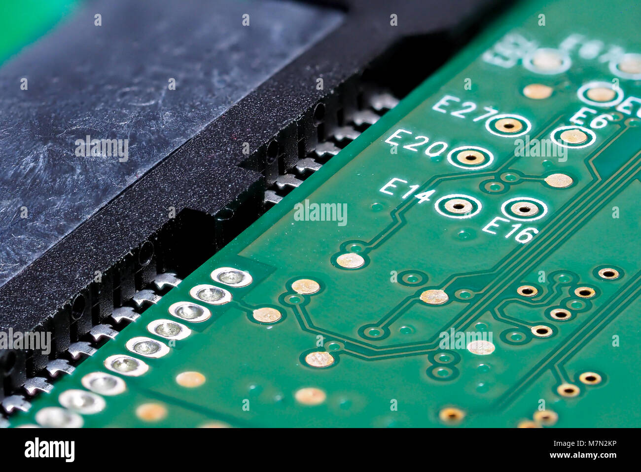 Closeup of green computer mother board, electronic elements and circuit Stock Photo