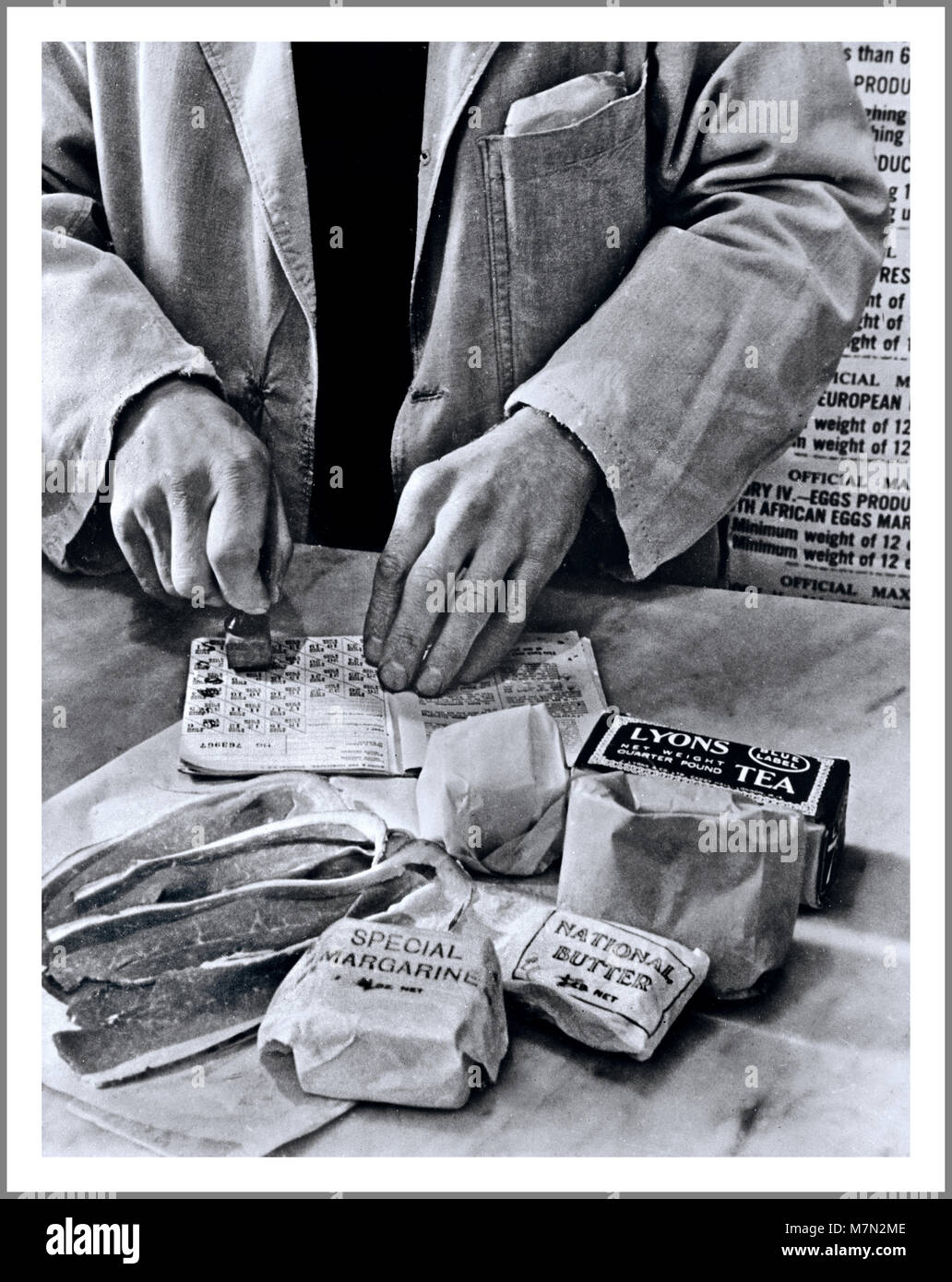 Food Rationing 1940’s WW2 British information propaganda image of food stamps in use during food rationing in the UK during World War 2 Stock Photo