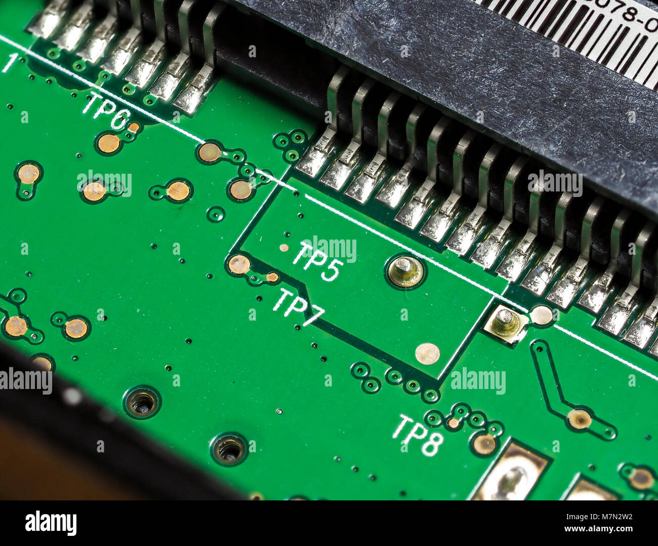 Closeup of green computer mother board, electronic elements and circuit Stock Photo