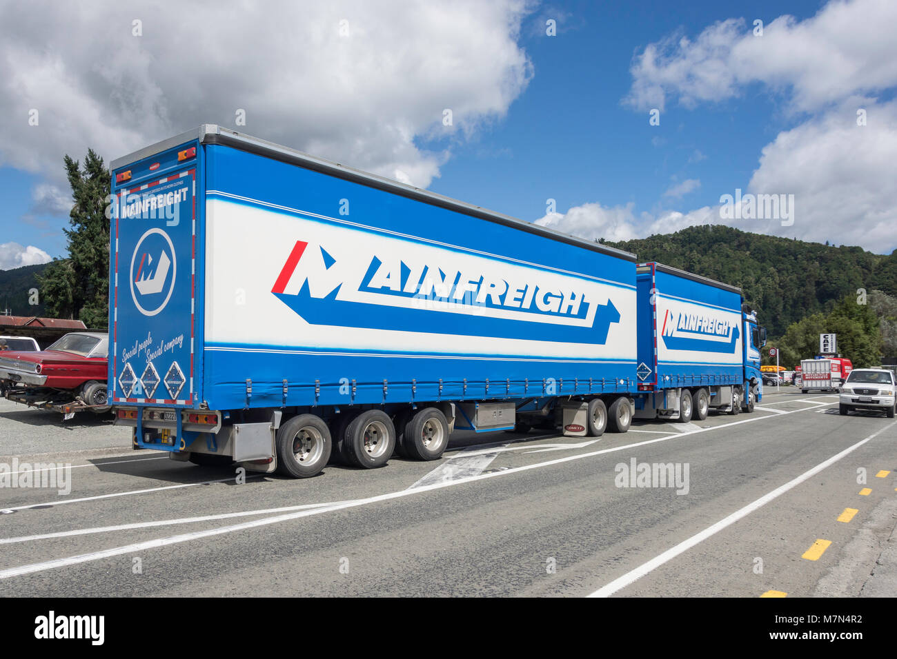 Mainfreight semi-trailer truck on State Highway, Murchison, Tasman Region, New Zealand Stock Photo