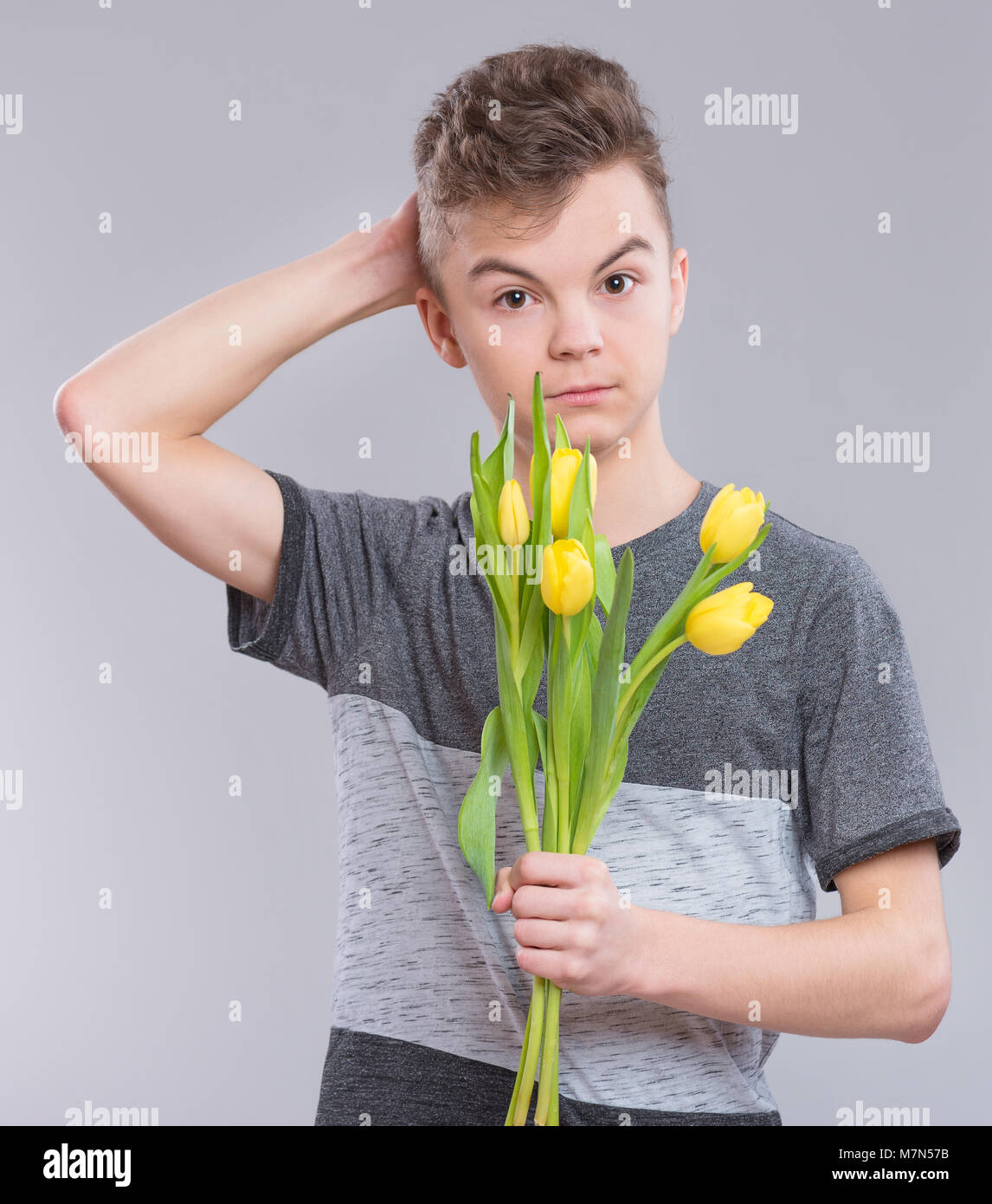 Teen boy with flowers Stock Photo Alamy