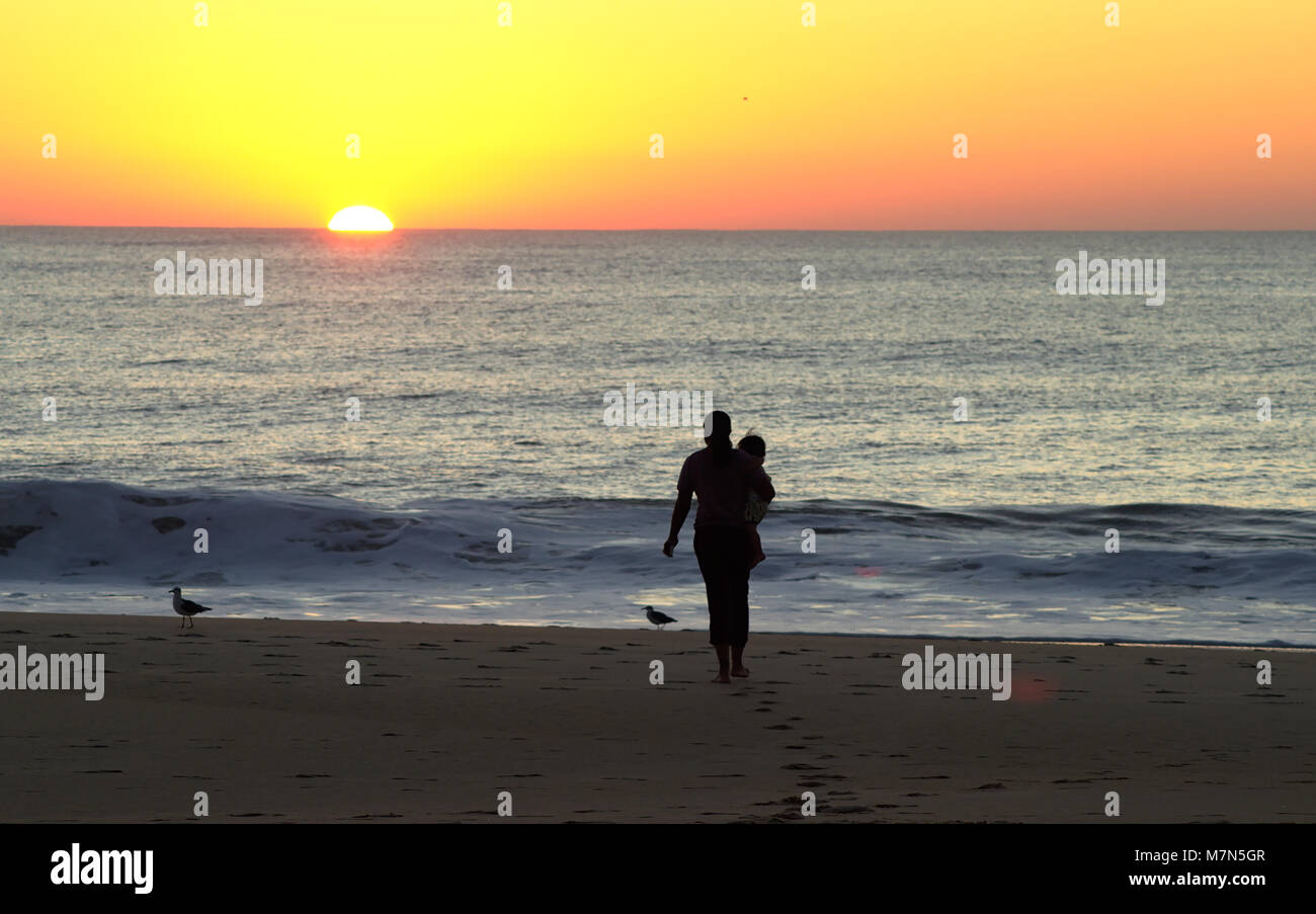 People watching sunrise on Atlantic Ocean Stock Photo - Alamy