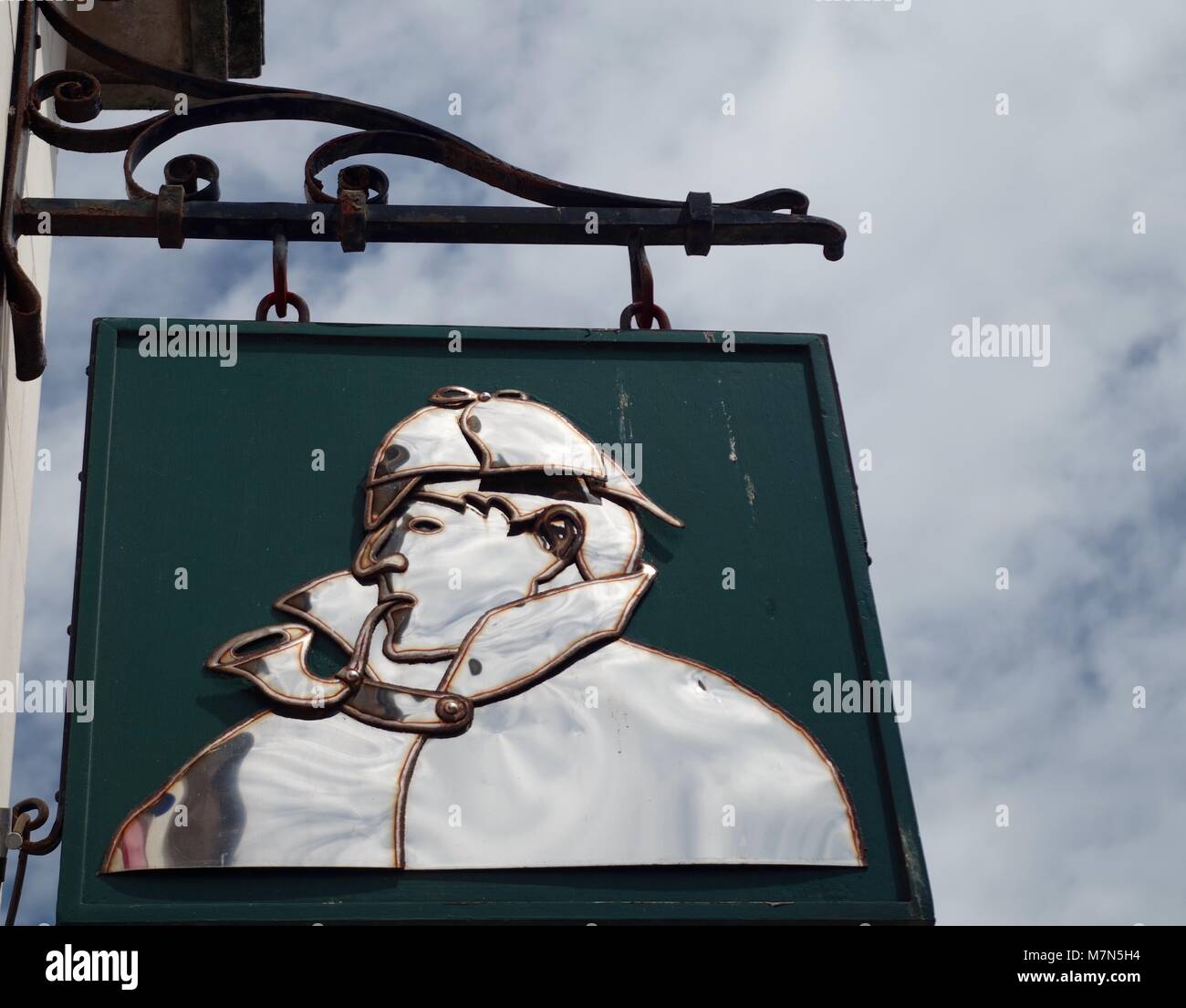 Sherlock Holmes Sign, Pipe Smoking. Hanging by Mcgahey's Tobacconist, Exeter City Center, Devon, UK. Stock Photo