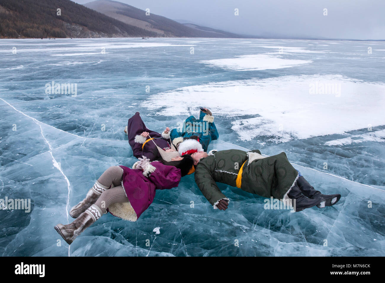 Hatgal, Mongolia, 3rd March 2018: mongolian young people  on a frozen lake Khuvsgul during a ice festival in winter Stock Photo