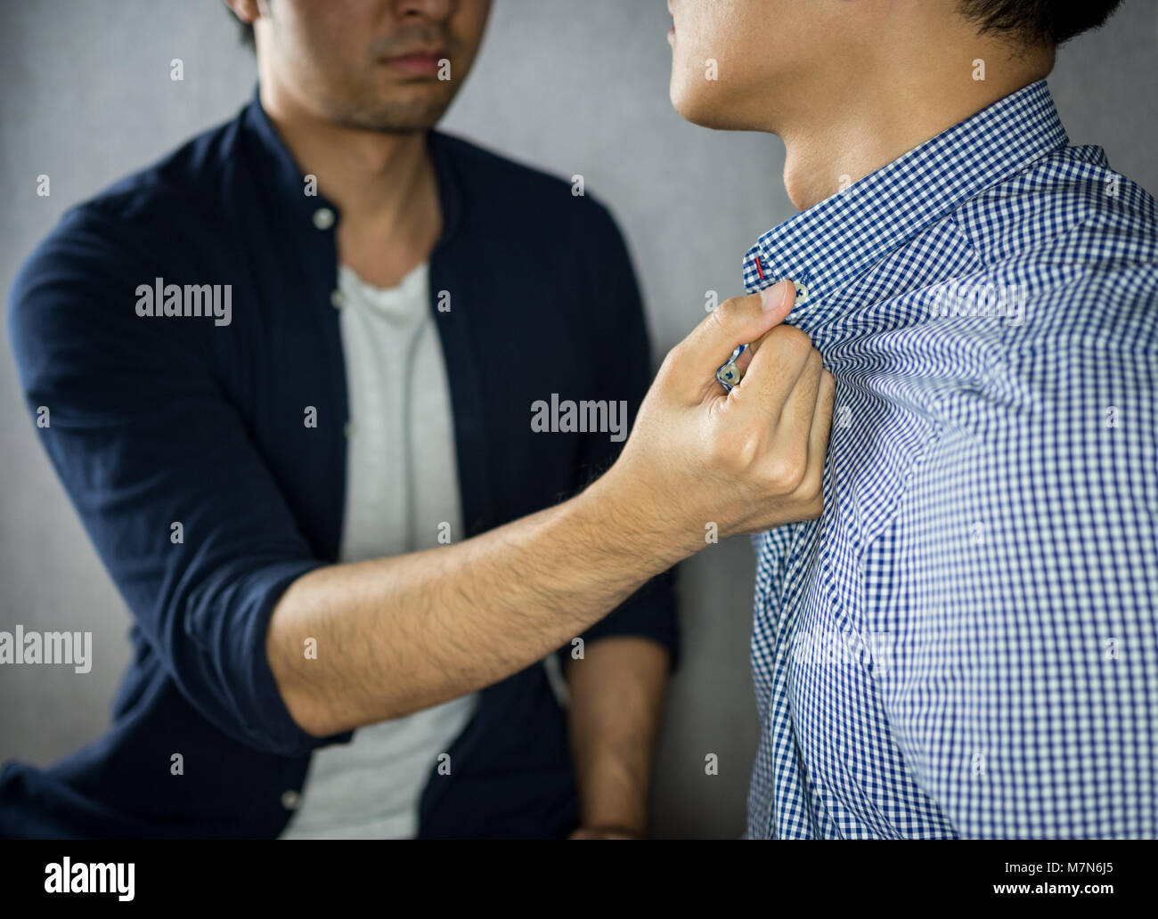 Grab by collar hires stock photography and images Alamy