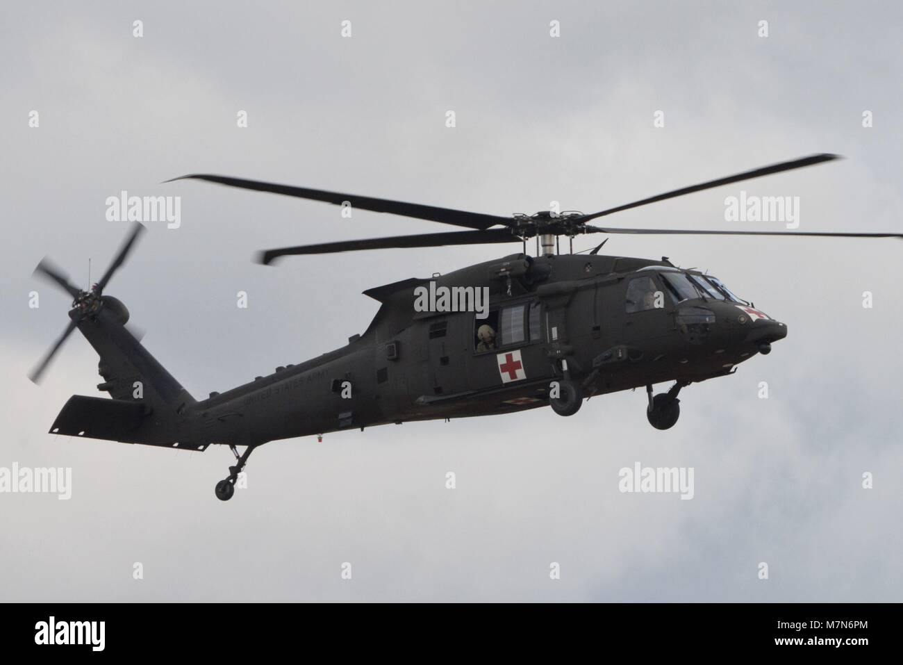 ANSBACH, Germany- Soldiers from the 2-227th Aviation Regiment, 1st Air Cavalry Brigade out of Fort Hood Texas conduct a roll-on landing in a HH-60 MEDEVAC helicopter, March 7, 2018, at Katterbach Army Airfield in Ansbach, Bavaria, Germany. A roll-on landing is conducted under limited power conditions such as a single engine failure. The Pilot uses the thrust from the rotor system to slow the aircraft down instead of additional power from the engine. This technique is known as aerodynamic braking. (U.S. Army photo by Charles Rosemond) Stock Photo