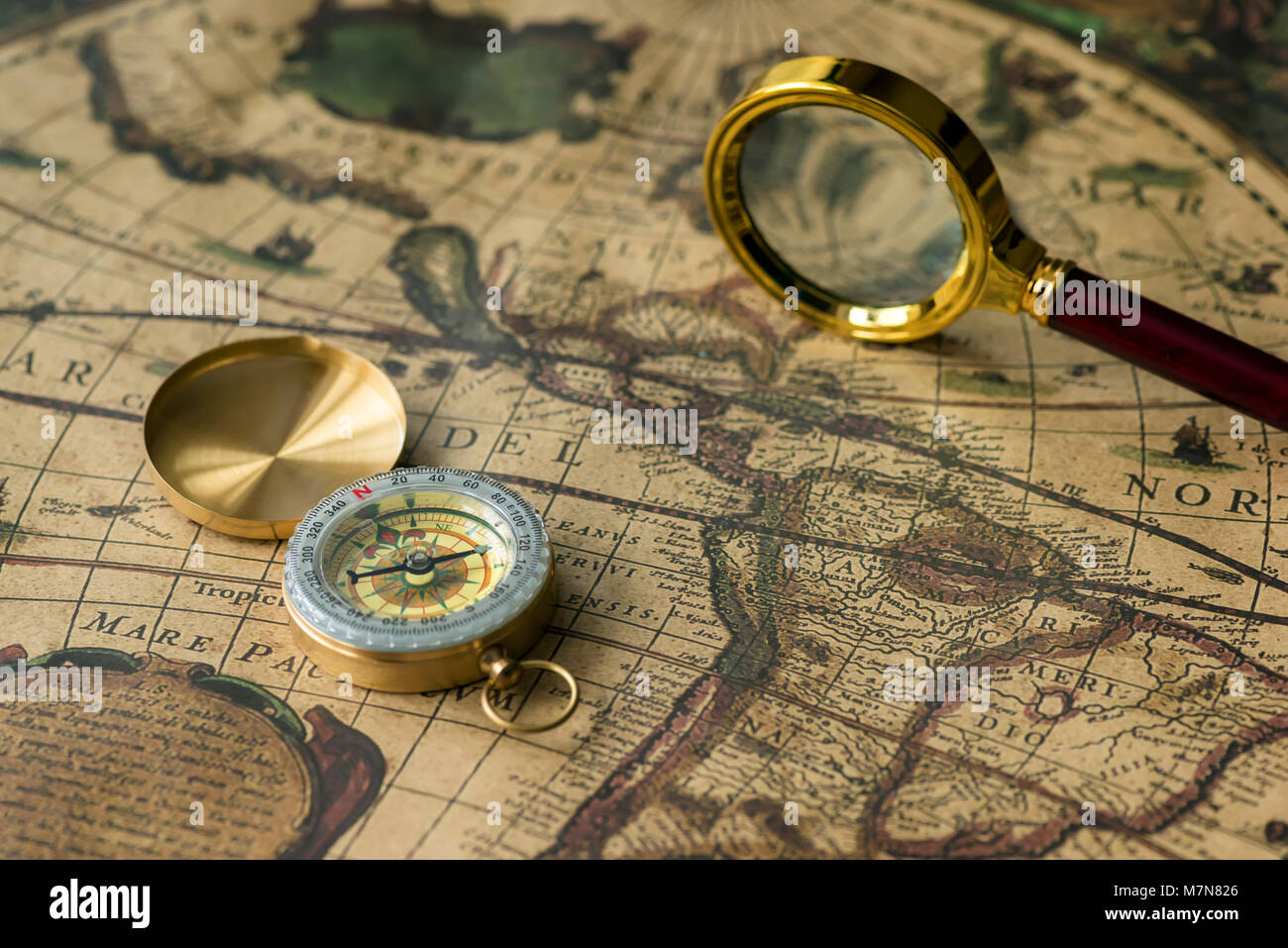 Compass and Chess on old map Stock Photo by ©kwanchaidp 75914687