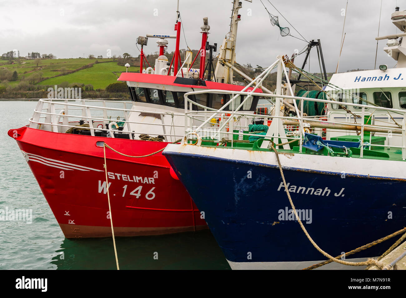 Commercial sea fishing trawlers moored in Union Hall Harbour, West Cork, Ireland. Stock Photo