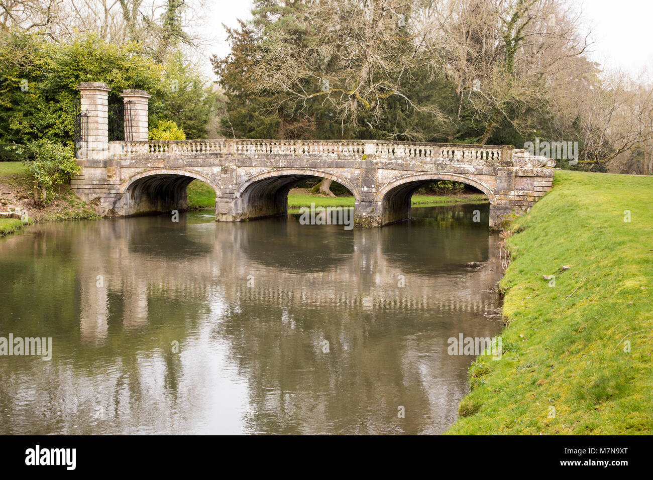 Historic ornamental stone bridge over River Avon in Amesbury Abbey Park