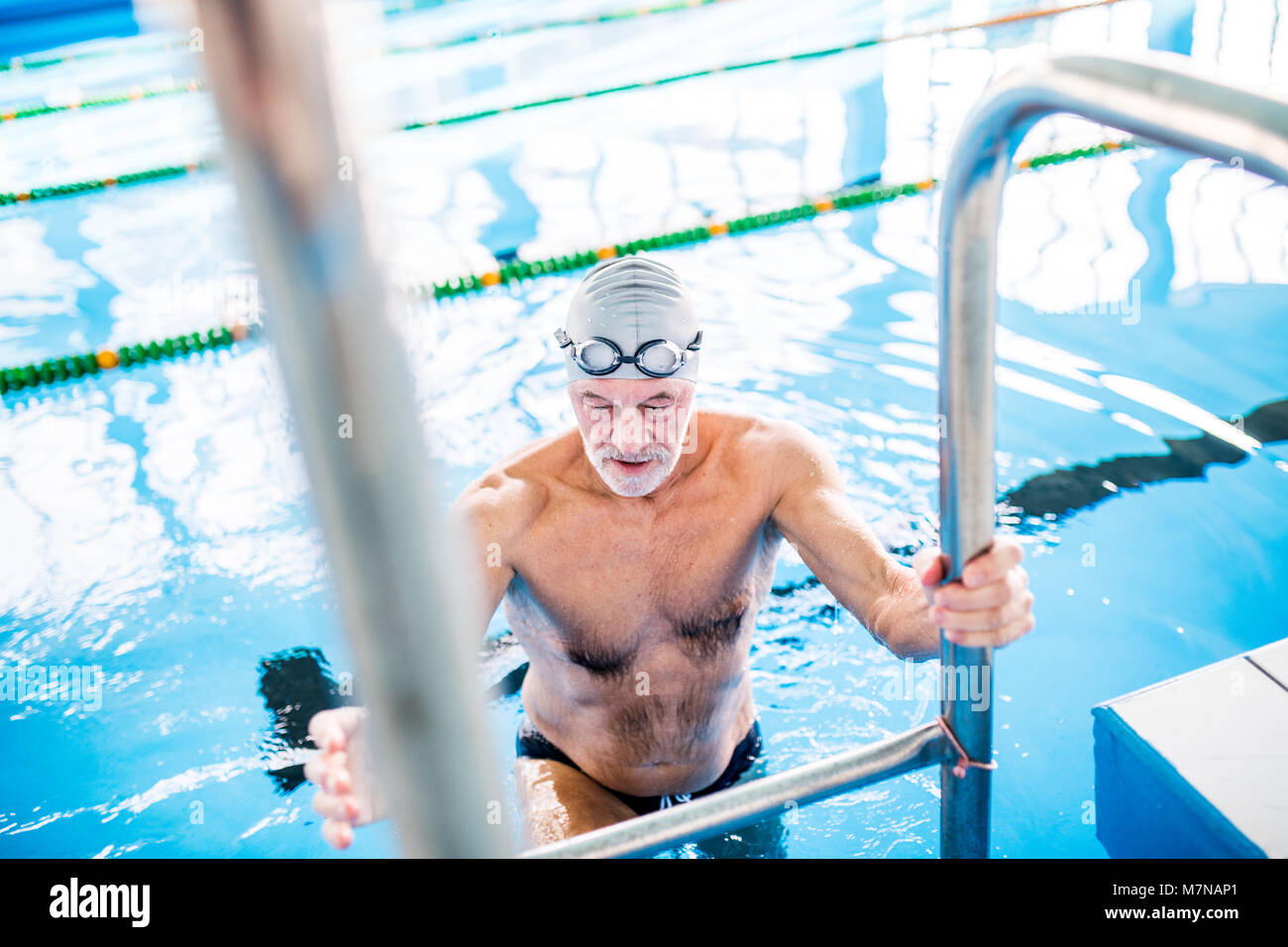 Man getting into pool hi-res stock photography and images - Alamy