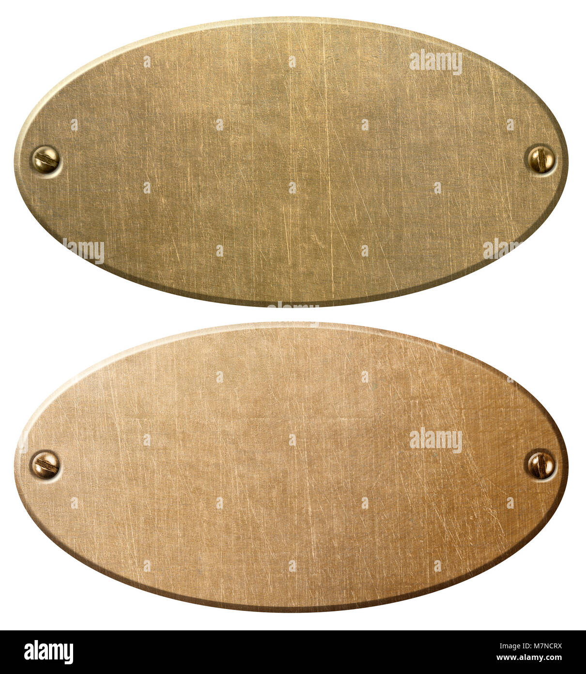 old copper and brass oval metal plates or nameboards Stock Photo