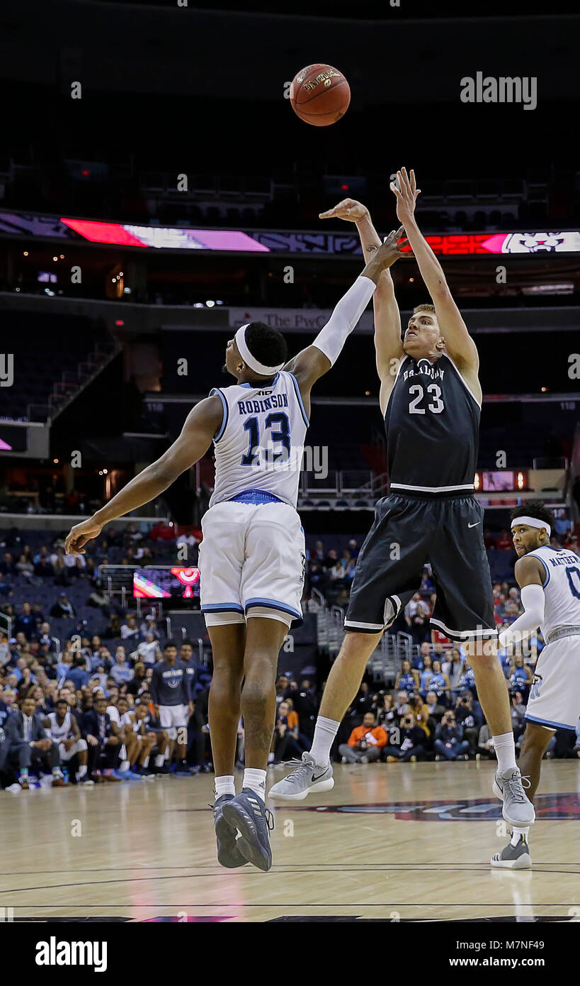 March 11, 2018: Davidson Wildcats F #23 Peyton Aldridge takes a shot over Rhode Island Rams G #13 Stanford Robinson during the A10 Championship Men's Basketball game between the Davidson Wildcats and the Rhode Island Rams at the Capital One Arena in Washington, DC Justin Cooper/CSM Stock Photo