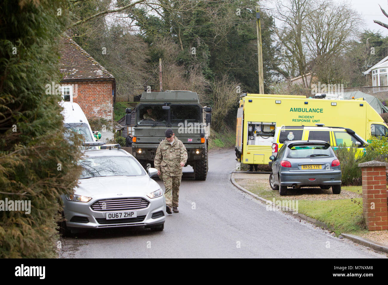West Winterslow, Salisbury, Wiltshire, UK. 12th March, 2018. The Army are brought in to collect an Ashley Wood recovery van from West Winterslow that was thought to have been used to tow Sergei Skripal's BMW away. Army personal, dressed in hazzard suits can be seen attaching the van to a cable ready to be pulled onto a recevery trailer Credit: John Rose Photography/Alamy Live News Stock Photo